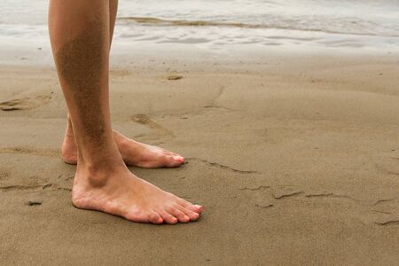 Texture, background. the sand on the beach. loose granular substance, pale yellowish brown, resulting from the erosion of siliceous and other rocks and forming a major constituent of beaches,の写真素材