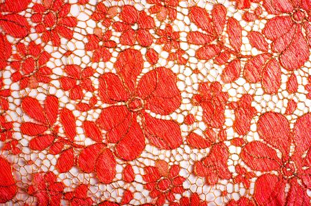 texture lace. a fine open fabric, typically one of cotton or silk, made by looping, twisting, or knitting thread in patterns and used especially for trimming garments.の写真素材