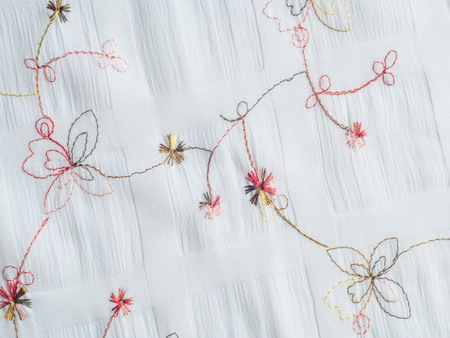Texture. White fabric with embroidered flowers. Photos made in the studioの写真素材