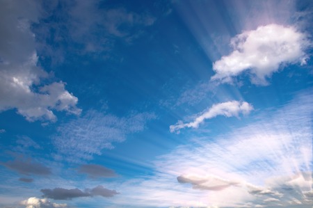 clouds. a visible mass of condensed water vapor floating in the atmosphere, typically high above the ground.の写真素材