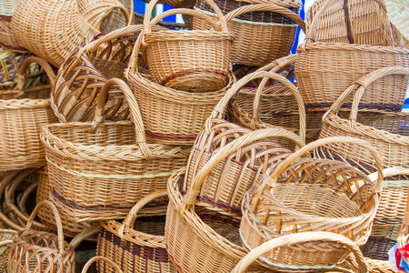 baskets woven from willow twigs. a container used to hold or carry things, typically made from interwoven strips of cane or wire.の写真素材