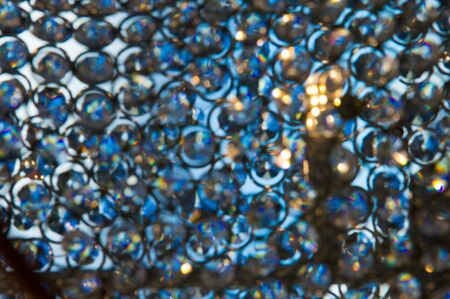 Texture, pattern, background. light crystal chandelier with blurred focusの写真素材