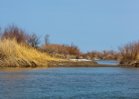 river last ice. Last ice-floe. last needle ice on the Ili River. Central Asia, the steppes of Kazakhstanの写真素材