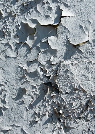 Texture of old paint. Old paint is chipping on the weather conditions