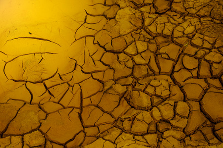 Texture, background, pattern. Cracked earth, clay. Abstract nature background with cracked earth. Dry cracked earth background, clay desert texture.の写真素材
