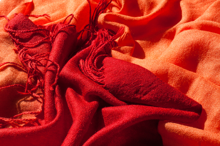 Texture, background, pattern. Red woolen female scarfの写真素材