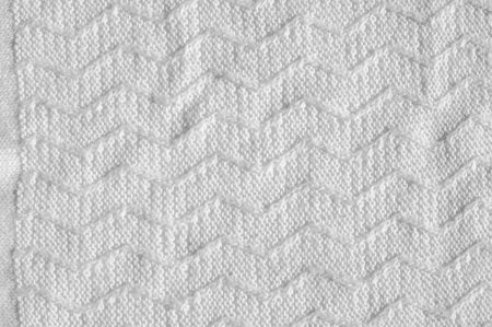 Texture, background, pattern. Women's woolen white winter sweaterの写真素材