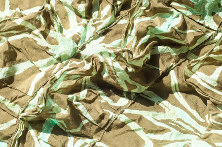 Texture, background, pattern. Women's skirt. Fabric cotton protective color khaki. Textile fabric is dull brownish-yellow in color, in particular, a strong cotton clothの写真素材