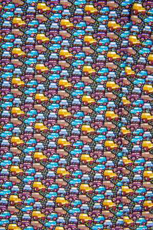 Texture, fabric, background. Cotton fabric. Cars coloring.  A lot of cars on a summer road roads.の写真素材