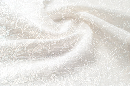 Texture background image, white background with lace flower. Texture background pattern. Lacy white fabric. White guipure, embroidery on fabric for a wedding dress, postcard, photo wallpapers, poster,の写真素材