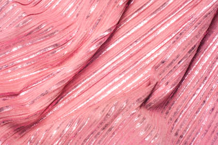 Texture, fabric, background. The hippo's skin is pink in color, the strips are white shiny, silvery polski, golden.の写真素材