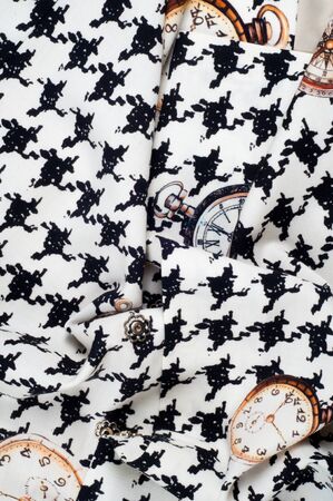 Texture, fabric, background. Texture of female dress white with black figures, cotton cloth with a...