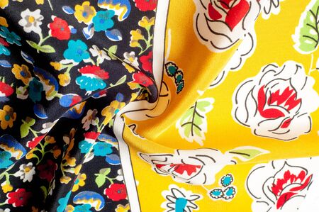 Texture background pattern. Silk fabric, floral pattern on a yellow background. On a black background. Flower textile or fabric. Texture of fabric. Fabric, textiles, fabric, material, woven.の写真素材