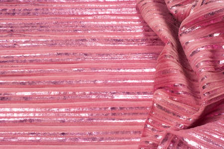 Texture, fabric, background. The hippo's skin is pink in color, the strips are white shiny, silvery polski, golden.の写真素材