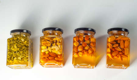Honey with nuts closed in jars. Good for your healthの写真素材