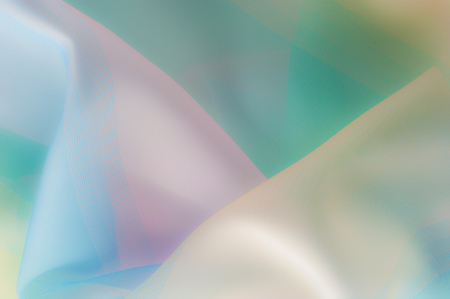 Blurry, not sharp sharpness Texture, background, pattern. Silk fabric is transparent, yellow-pink...
