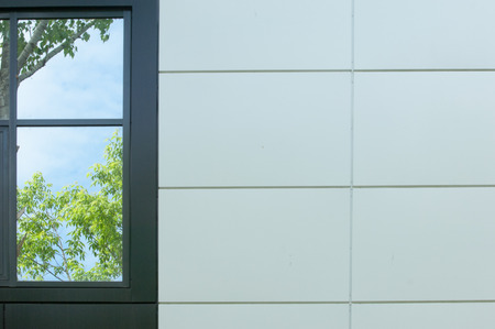 Texture, pattern, background. The wall of an office building with a window