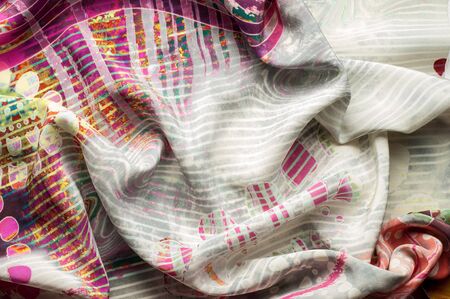 Texture background image, Silk fabric with abstract pattern. Colorful silk fabric close-up.
