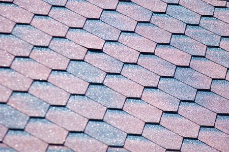 An asphalt shingle is a type of wall or roof shingle that uses asphalt for waterproofing. They are one of the most commonly used roofing covers in North Americaの写真素材