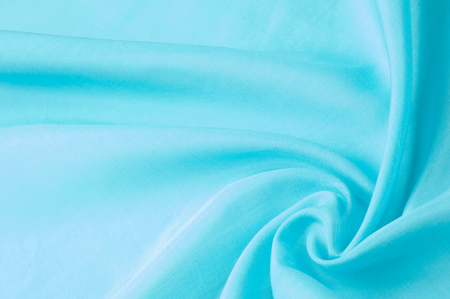 Texture background of fabric. Silk blue fabric, aqua, blue, Bondi blue, sky blue, blue blue, pink egg blue, Skobelov, turquoise, flower names. Smooth elegant blue silk or satin can be used as a backgroundの写真素材