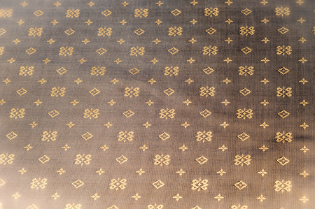 Texture background pattern. Brown silk fabric. Abstract background of luxury fabrics or liquid waves...