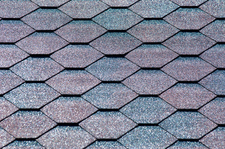 An asphalt shingle is a type of wall or roof shingle that uses asphalt for waterproofing. They are one of the most commonly used roofing covers in North Americaの写真素材