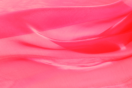 Texture, background, pattern. Cloth is transparent light pink. Which allows you to see the body or underwear of the user through his fabric.の写真素材