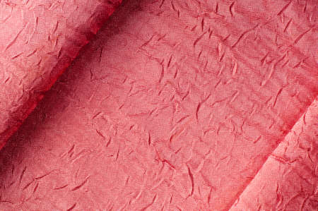 Texture, background, pattern. Cloth silk dense pink. Jacquard fabric