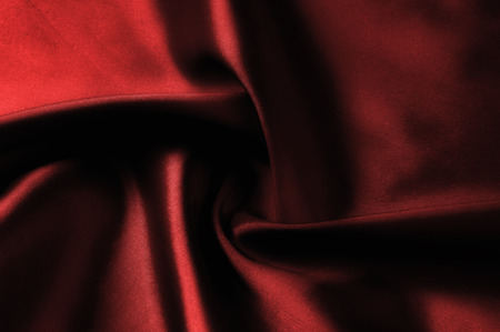 Soft focus. texture, pattern. cloth silk red. it is a light smooth drape that promotes movement. Thin and light, add a delicious piece to your autumn-winter design. Transparent, if you raise to light,の写真素材