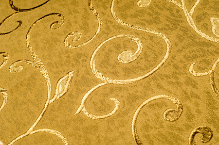 Texture, background, pattern. Damask fabric with shiny patterns on a matte background .. Golden...