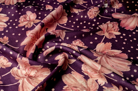 Texture, background, pattern. Silk fabric of lilac color. With painted peony flowers