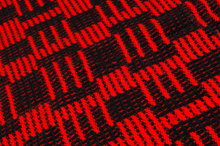 Texture, background, pattern. Soft warm cozy scarf in red cageの写真素材