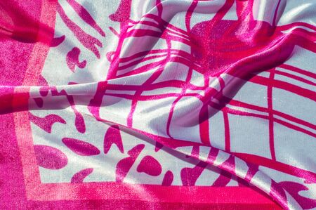Texture, fabric, background. Texture of a female dress with an abstract red pattern on a white...