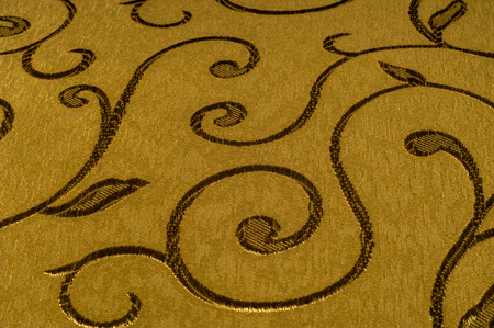 Texture, background, pattern. Damask fabric with shiny patterns on a matte background .. Golden...