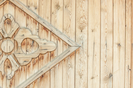 Texture, background, pattern. Part of the wooden gate decorated with patternsの写真素材