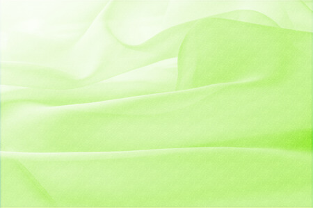 Texture, background, pattern. Silk fabric is transparent, green. Abstract soft chiffon texture background. Soft white chiffon with curve and waveの写真素材