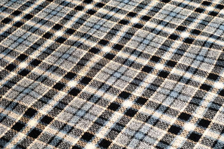 texture, background, pattern. Woolen fabric in a cage. Fabric structure. Fashion. Style. A square pattern. Model for textiles. Fashion design and interior design at homeの写真素材