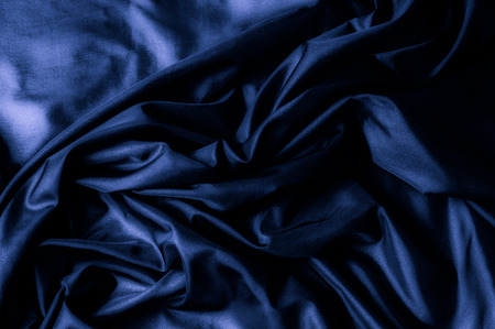 Texture, background, pattern. Dark blue silk fabric. Designer Solid Silk Cotton Blend Fabric - Dark Blue Lining Clothの写真素材