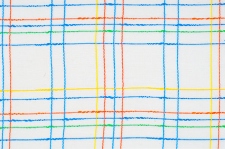 Texture, background, pattern. Shirt. Blue white pink green. Fabric shirt in a cage. Abstract pattern