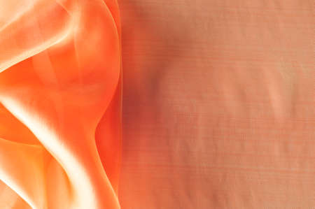 Texture, background, pattern. Orange Silk Fabric for Drapery Abstract Background. Abstract Fabric Flame Background, Artistic Waving Cloth Fractal Patternの写真素材