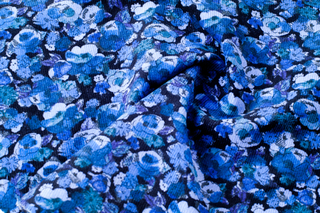 Texture background image, blue fabric with a pattern of flowers. Jeans floral background. Jeans...