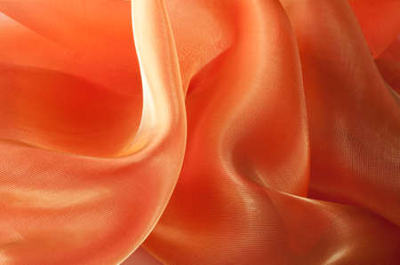 Orange Silk Fabric for Drapery Abstract Background. Abstract Fabric Flame, Artistic Waving Cloth...