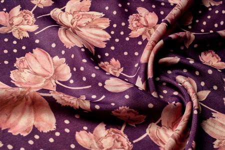 Texture, background, pattern. Silk fabric of lilac color. With painted peony flowers