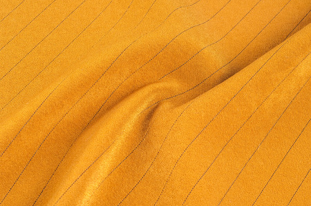Texture, background, pattern. Cloth is light brown with a thin black stripe. Fabrics, this very lightweight woven cotton blend seersucker fabric is light and summery. の写真素材