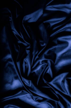 Texture, background, pattern. Dark blue silk fabric. Designer Solid Silk Cotton Blend Fabric - Dark Blue Lining Cloth の写真素材