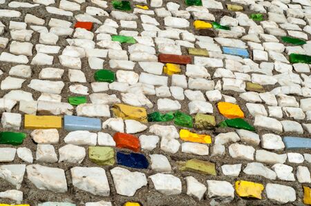 Texture, background, pattern. Closeup photo of multi-colored mosaic stones. Structure design decor. Swimming pool wall and floor finishingの写真素材