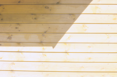 Texture, background, pattern. Good background. The boards are connected as a shield. A wooden wall with green grass. Wood texture, Natural wood background.の写真素材