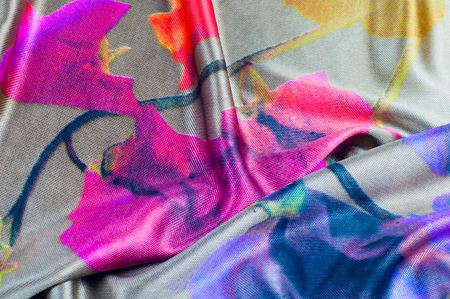 Background texture, pattern. silk fabric of gray color with a floral pattern. Rinse down the memory strip with this nostalgic, multicolored floral pattern with digital printing.の写真素材