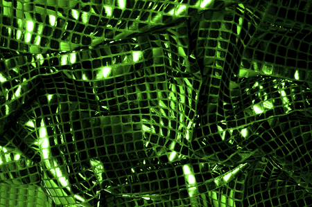 texture, background, pattern. Fabric with large paillettes made of green. Create a sharp look that is ready for attention with these multicolored oil stains of big sparkles.の写真素材