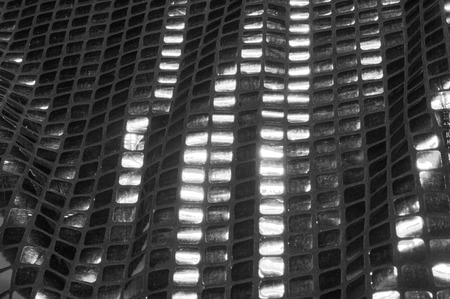 texture, background, pattern. Fabric with large paillettes of gray black. Like a binding paint mixed with a mirror effect, these gray reflective pale glitters are truly unique.の写真素材